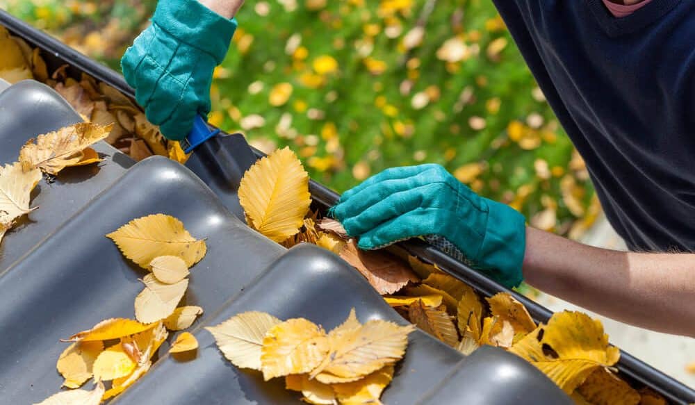 Man cleaning the gutter - Big Easy gutters